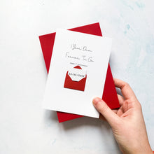 Load image into Gallery viewer, A Wedding Anniversary Date on a token, being hidden inside a mini handmade envelope on the front of a 1st Anniversary Greeting Card. The card reads 1 Year Down Forever To Go, Happy 1st Anniversary.