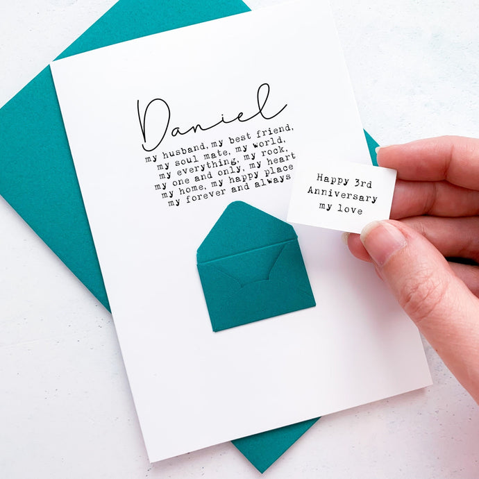 A personalised anniversary greeting card featuring a secret message hidden inside a mini 3d envelope on the front of the card. Text on the front lists adjectives to describe how special your husband or wife is, below their name.