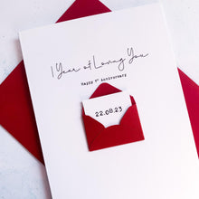 Load image into Gallery viewer, A personalised 1st anniversary greeting card featuring the words &#39;1 year of loving you&#39; and a secret message with the anniversary hidden inside a mini envelope. For a girlfriend or boyfriend to send to their partner on a 1st anniversary.