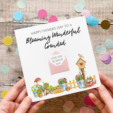 Load image into Gallery viewer, A handmade Father's Day card with a garden scene and a birdhouse, along with confetti and a message about a blooming grandfather.
