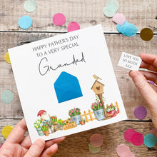 Load image into Gallery viewer, A handmade Father's Day card with a garden scene and a small note, held by a person's hands.
