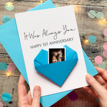 Load image into Gallery viewer, A handmade card with a photo of a couple inside a blue envelope, celebrating a first anniversary.
