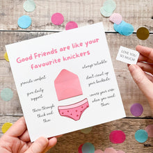 Load image into Gallery viewer, a hand holding a card with text and illustrations, including a pair of underwear and a note.