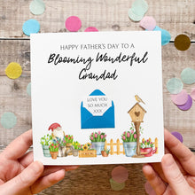 Load image into Gallery viewer, A handmade Father's Day card with a garden scene and a birdhouse, along with a message and a blue envelope.