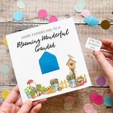 Load image into Gallery viewer, A hand holding a card with a message for a father's day, surrounded by confetti and potted plants.